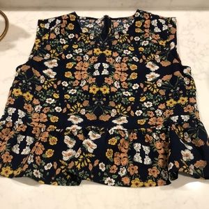 Blue floral sleeveless peplum top by Lowrys Farm